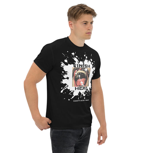 White male model wearing Finish Here Tee by Daddy's Secret Toolbox. Black tee with original artwork. Antique drawing of mustache man with mouth wide open anticipating a facial.