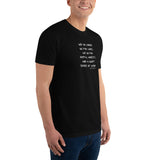 Black t-shirt worn by a gay man, emblazoned with the empowering mantra 'We No Longer Go For Looks' in bold white letters