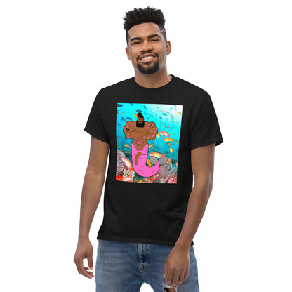 Black t-shirt with a vibrant graphic of a muscular merman covered in tattoos, swimming in a deep blue ocean.